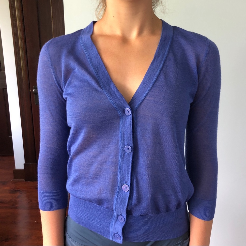 Light purple button up sweater.